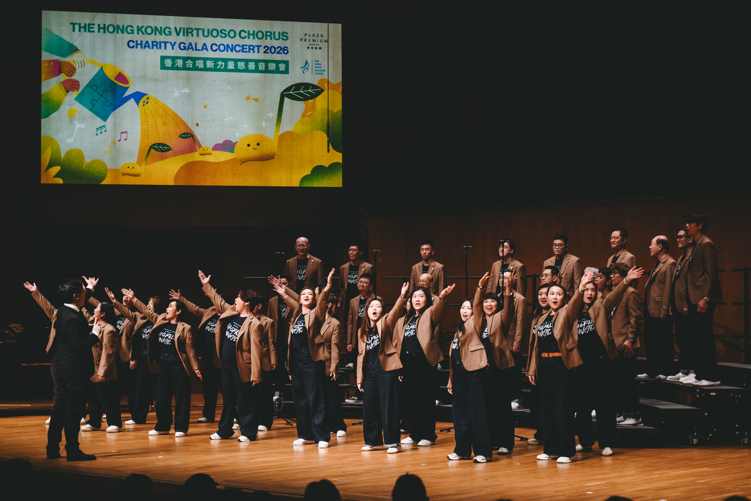An HKVC vocal coach leading an adult choral workshop